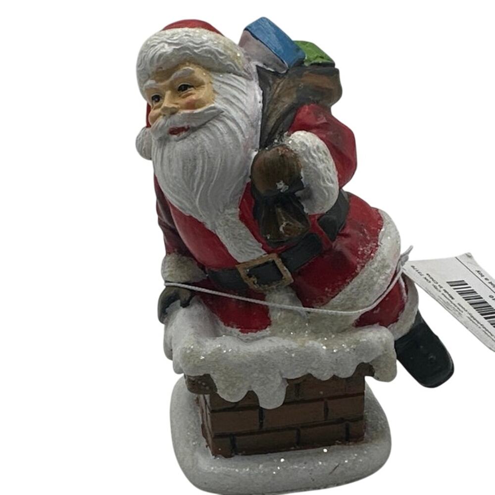 Santa clause coming down chimney. Brand new. Hobby Lobby 4” figurine NWT